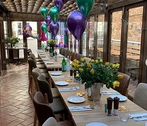 Long table laid in the covered patio