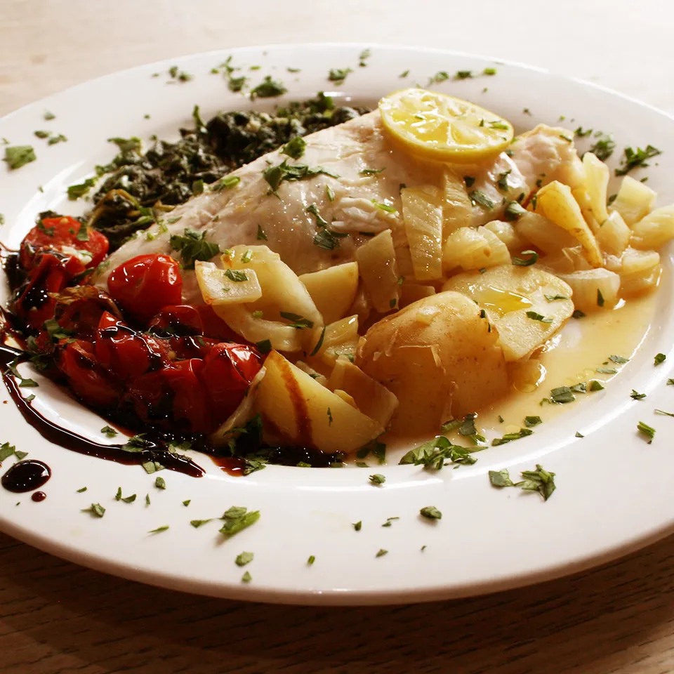 Fish fillet with potatoes and roasted cherry tomatoes